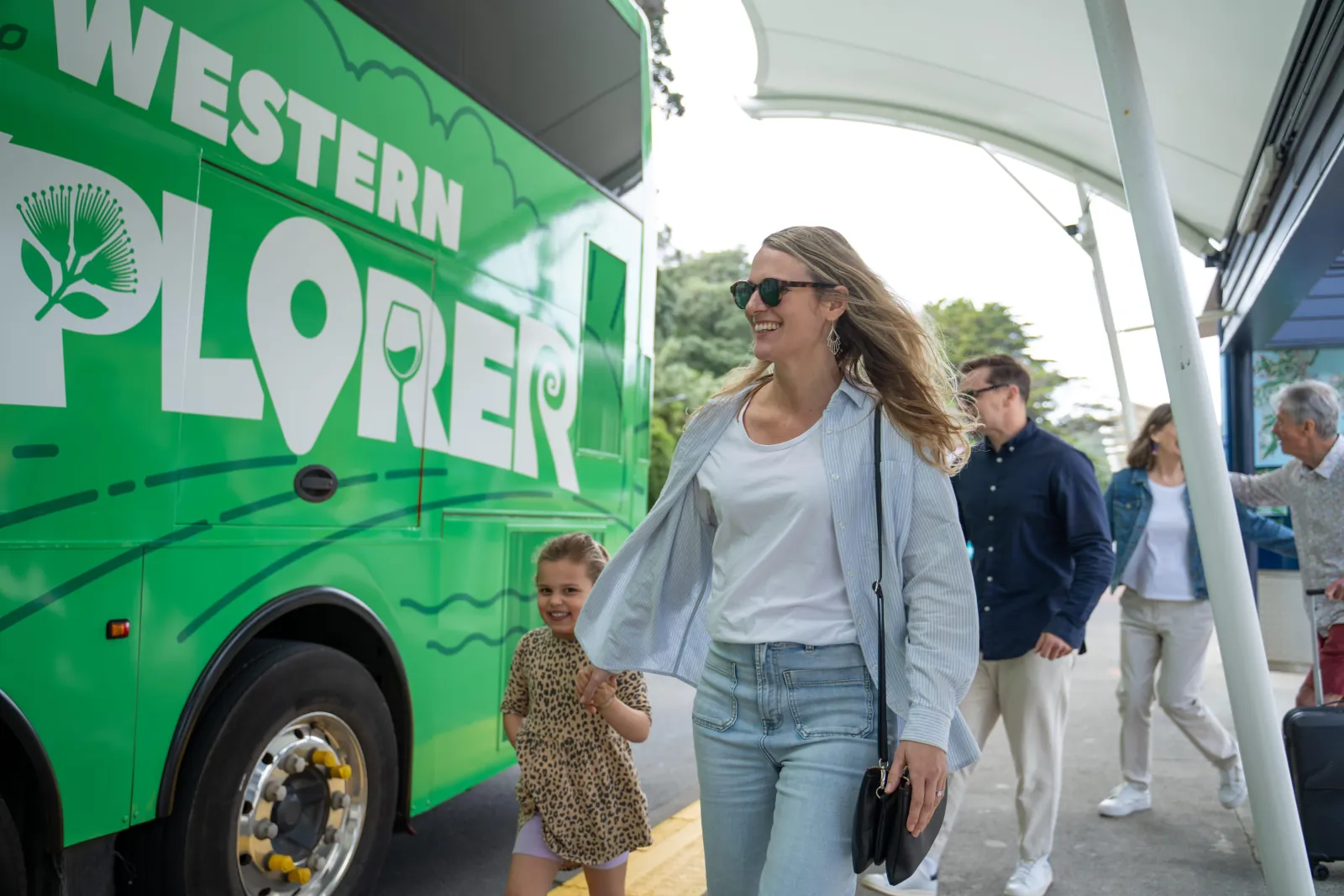 Passengers stepping off the Western Explorer hop-on hop-off bus