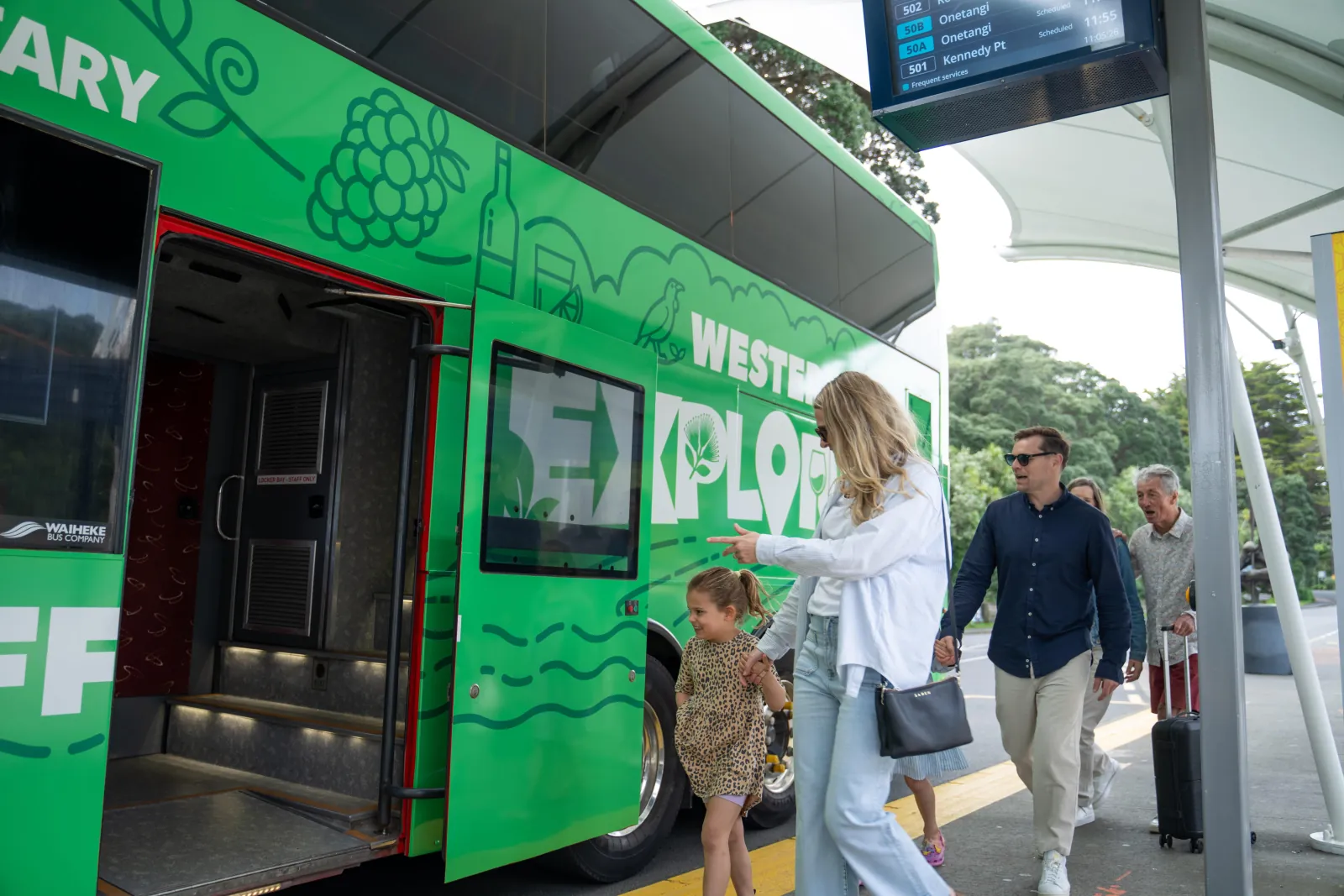 Travellers boarding the Western Explorer bus at a covered stop