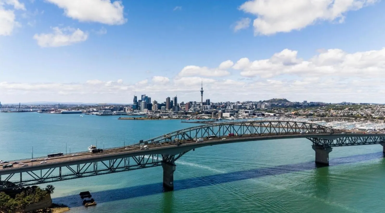 Aerial view of the Harbour Bridge carrying traffic with the city skyline beyond
