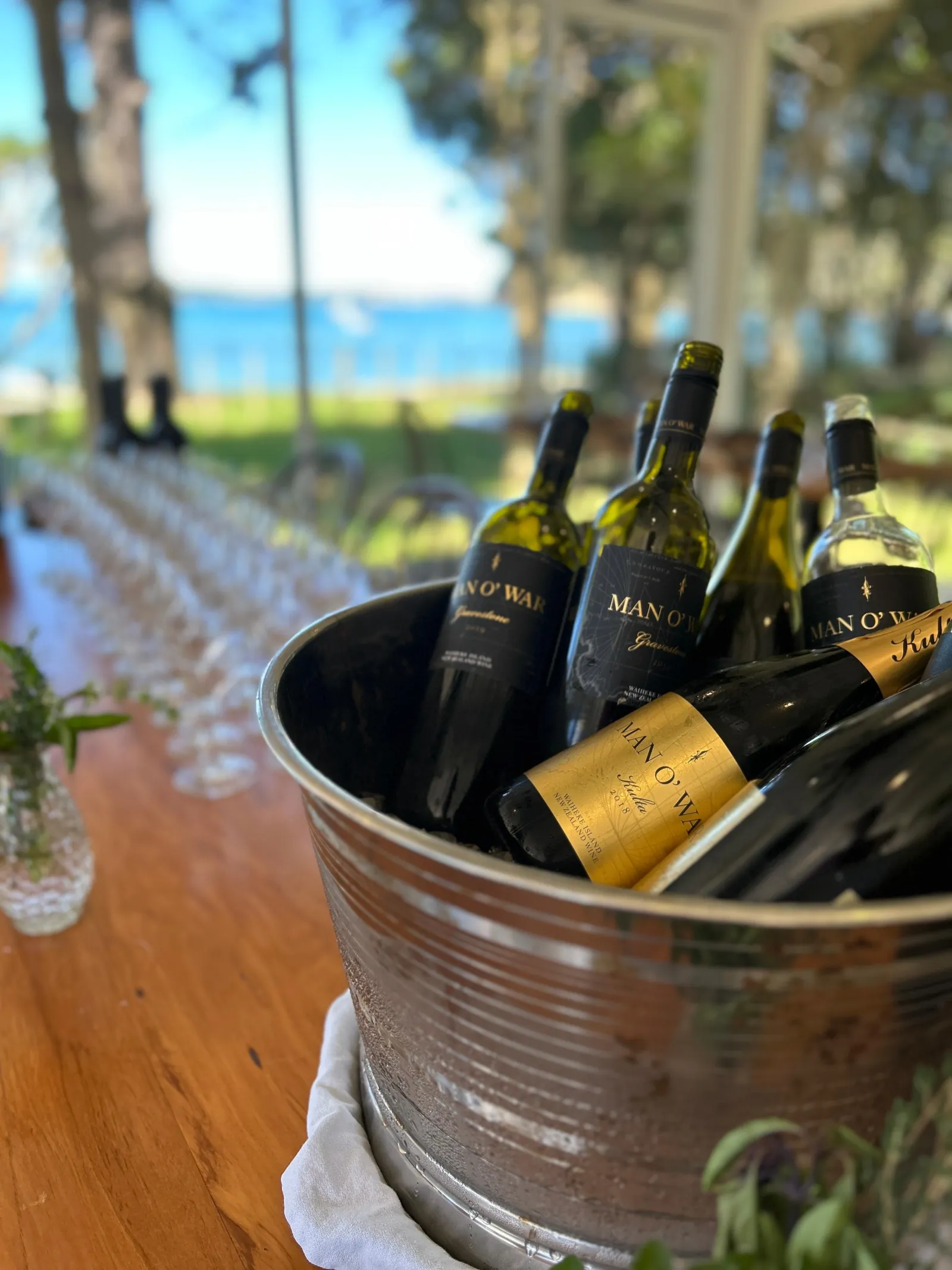 Bottles of Man O' War wine chilling in a metal bucket